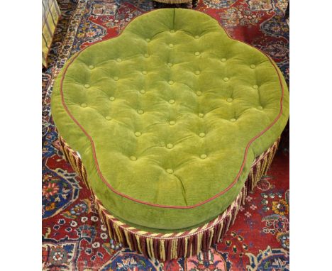 A button upholstered green and crimson edged centre stool, 140 cm x 112 cm
