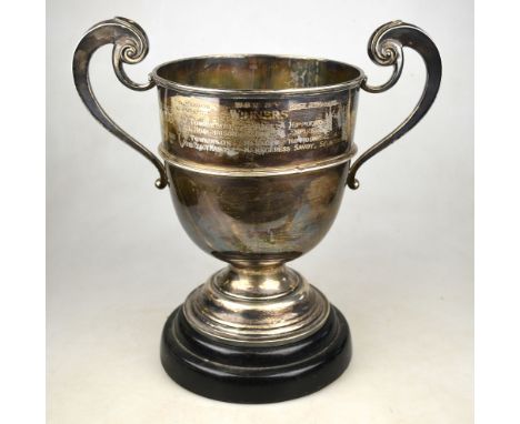 A silver trophy cup with twin scroll handles, on stemmed foot, Harrison Brothers & Howson, London 1906, 26.5 oz, 25 cm high, 