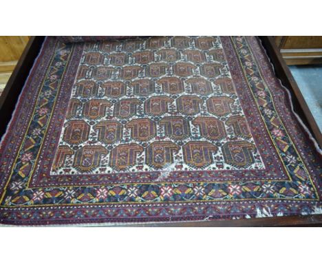 A Persian Afshar small carpet, with repeating boteh design within floral borders, 194 x 152 cm