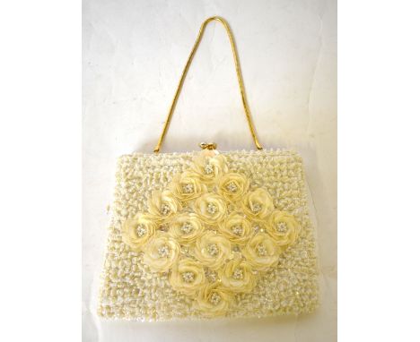 Sixteen assorted vintage evening and clutch bags comprising; a 1960s white beaded and lustred sequinned flower-head evening b