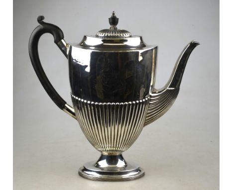 An oval silver half-reeded coffee pot in the Adam manner, with composition handle of finial, on stemmed foot, engraved with a