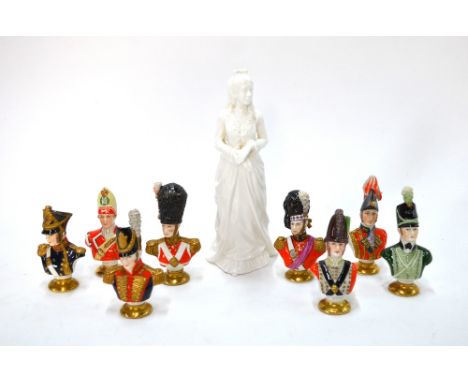 A Royal Doulton white monochrome figure of a standing Victorian girl, 21 cm. high; together with eight small portrait busts o