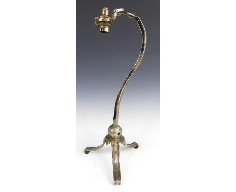 A circa 1900 Artificers Guild silver plated table lamp, the fitting with hinged action, on elongated shaped stem to triform s