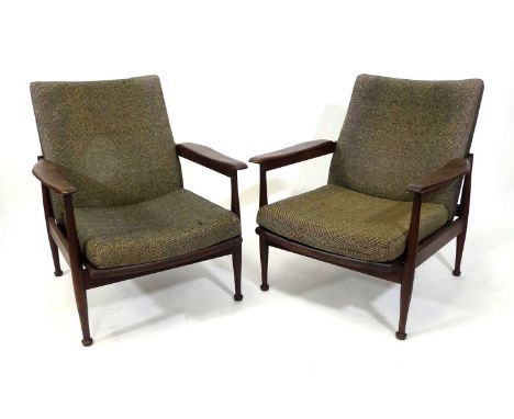 Guy Rogers - a pair of 1960s teak 'Manhattan' armchairs, each with slightly shaped and curved arm rests, fabric upholstered, 