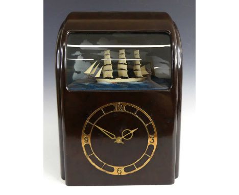 A Vitascope Industries electric diorama clock, circa 1948, housed in a brown bakelite case, with gilt metal applied chapter r