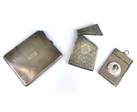 A Art Deco silver cigarette case, having engine turned exterior with monogrammed cartouche and gilt-washed interior, the hing