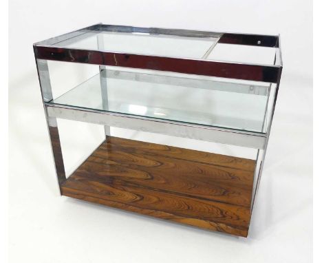 Merrow Associates - a 1960s chrome, rosewood and glass inset three-tier tea trolley, raised on roller castors, of Allen key c