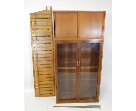 A 1970s Ladderax teak modular wall unit, comprising; double door glazed display unit with four interior adjustable glass shel
