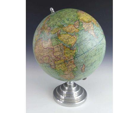 A mid-20th century 12" table globe by Girard Barrère et Thomas of Paris, raised on a stepped brushed aluminium circular base,