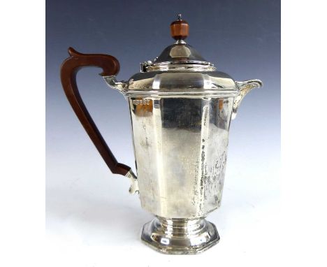 An Art Deco Scottish silver hot water pot, of inverse tapering octagonal form to an octagonal slightly domed pedestal foot, h