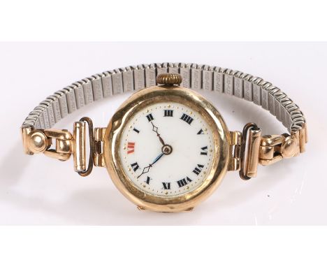 9 carat gold ladies wristwatch, with a white enamel dial 