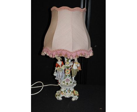Capodimonte porcelain lamp, modelled with a pair of figures with flowers, Crown over N mark