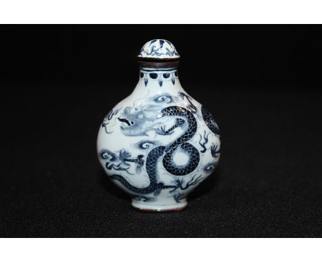 Oriental enamel snuff bottle with dragon design