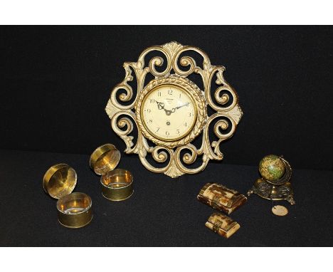 Smiths wall clock, housed in a pierced scrolled gilt frame, small globe on a brass dish base, two brass pots and covers, two 