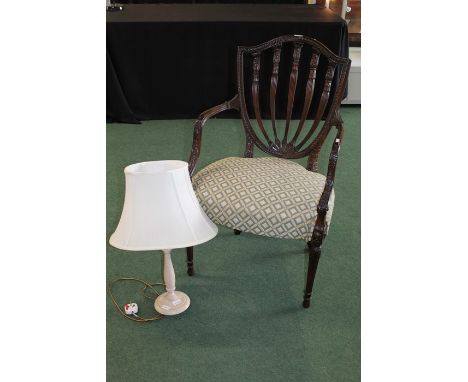 19th Century mahogany armchair, with an arched shield back and stuff over seat and tapering fluted legs, together with a tabl