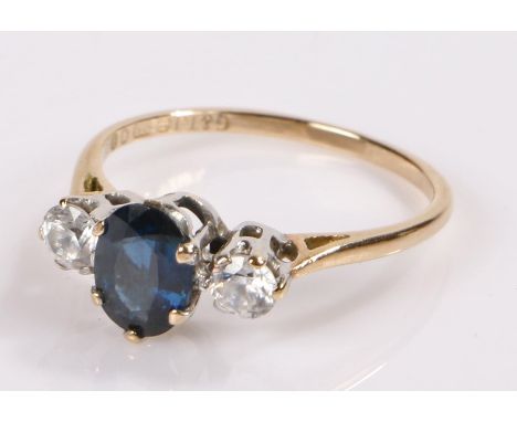 9 carat gold ring, set with a blue stone and flanked by white stone, ring size M