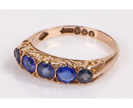 9 carat gold ring, set with blue stones, ring size N
