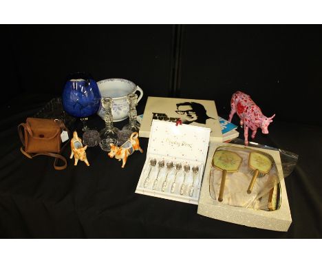 Mixed objects, to include a chamber pot, a large blue glass, vanity set, model cow, pair of cows, Box Brownie, glass dressing