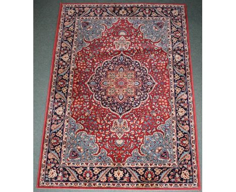 Mossoul Middle Eastern carpet, the red ground with lozenge pattern centre and foliate borders