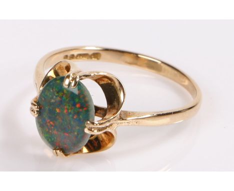 9 carat gold ring, with an opal effect stone, ring size M 1/2