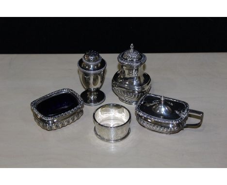 Silver, various dates and makers, to include two pepperettes, napkin ring, salt and mustard pot with blue glass liners, 7.2oz