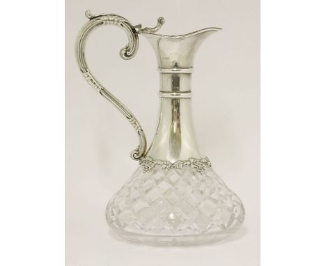 A modern silver-mounted cut glass claret jug,maker's mark worn, Birmingham 1979,with trailing vine decoration to bottom of ne