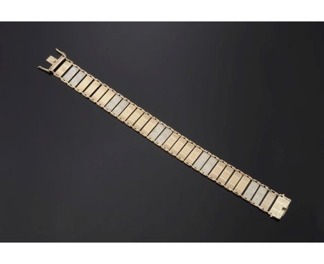 A two-colour gold plaque link bracelet,with alternating sets of flat, rectangular, yellow and white bars.  Engine turned hand