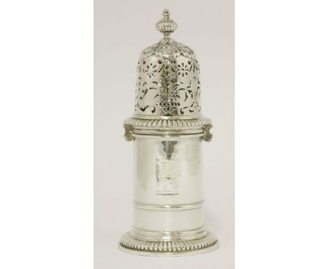 A William III silver caster,by Andrew Raven, London, possibly 1698,of cylindrical form with moulded girdle on gadrooned sprea