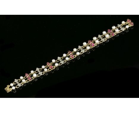 A ruby, diamond and pearl gold bracelet, c.1830,with alternating bar links with trefoil ends, set alternately with rose cut d