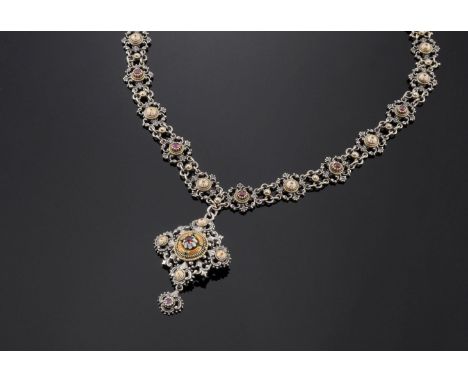 An Austro-Hungarian silver garnet and enamel necklace, c.1900,with an offset square centrepiece.  The pendant drop composed o