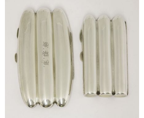 Two silver cigar cases,one by A & J Zimmerman Ltd, Birmingham 1904, monogrammed,14cm long,the other by William Hutton & Sons 