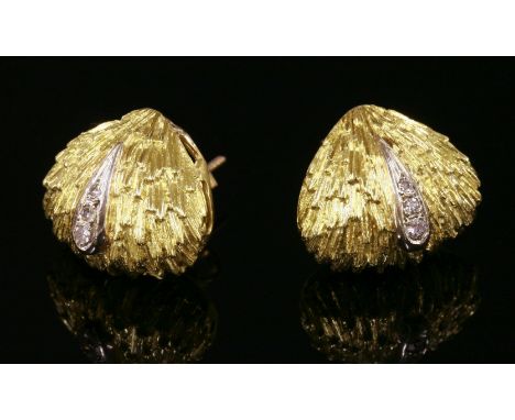 A pair of gold, diamond set stud earrings,of cushion-shaped triangular form, with a deeply textured ground.  Three graduated 