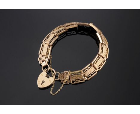 An Edwardian five-row gate link bracelet,by Lawson Ward & Gammage, with a central hand engraved wide bar.  Pairs of crimped a