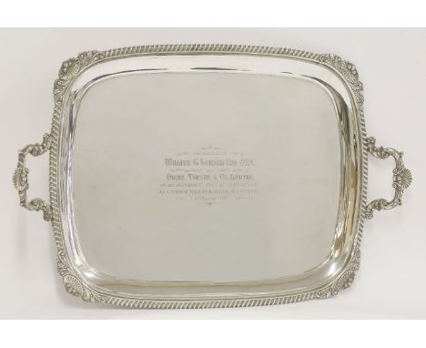 A silver two-handled tray,by Harrison Brothers & Howson, Sheffield 1939,of oblong form with shell leafy scroll and gadroon bo
