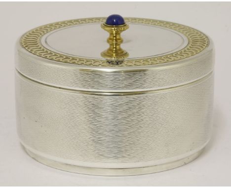 An unusual large box,by Garrard & Co. Ltd., London 1993,of engine turned circular form, the pull-off cover with silver gilt g