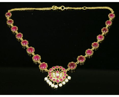 An Indian high carat gold, synthetic ruby, synthetic white sapphire and cultured pearl necklace,a spray style pierced centrep