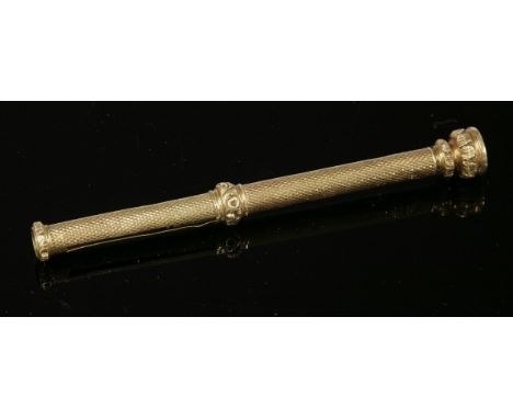 A gold slide action propelling pencil, c.1830,by Sampson Mordan & Co., with a fine barley engine turned barrel.  A deeply cha
