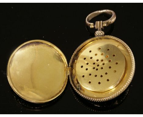 A gold circular hinged vinaigrette, c.1830,of pocket watch form, with a chased rose to the centre of both covers.  An engine 