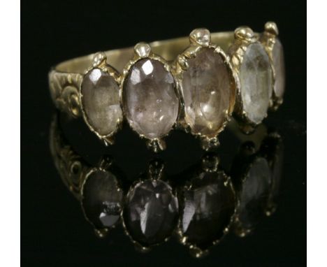 A William IV five stone foiled quartz gold ring, c.1830,  HBwith five graduated oval mixed cut foil-backed quartz, set to ova