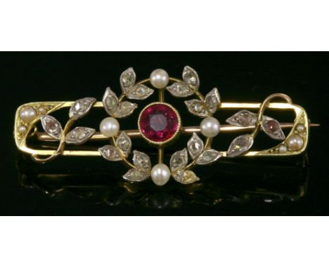 A Belle Époque ruby, diamond and seed pearl bar brooch,with a circular mixed cut ruby, milligrain set to the centre.  A laure