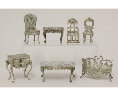 A collection of seven silver miniatures,mixed dates and makers, some with import hallmarks,comprising:a side table with drawe