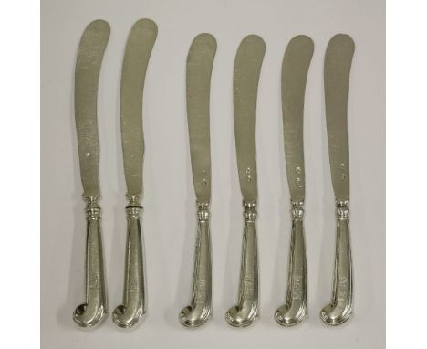 A set of four 18th century Irish silver pistol handled knives with silver blades,possibly Dublin c.1733,crested*,20cm long, a