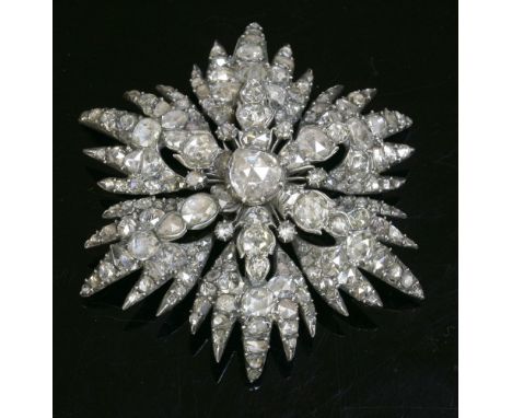 A Georgian diamond set star brooch,with a Dutch rose cut diamond, set in a cut down collet at the centre.  An arched six-poin