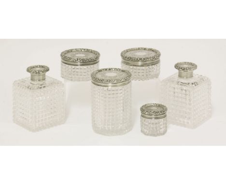 Six Victorian silver-mounted cut glass toilette bottles, by Frances Douglas, London 1854,of various sizes and shapes, the eng