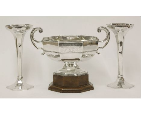 A large silver two-handled bowl with pair of vases en suite,by Walker & Hall, Sheffield 1922,the bowl of octagonal form on pe