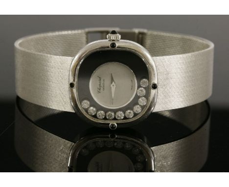 A ladies' 18ct white gold, diamond set, Chopard mechanical bracelet watch, c.1970,for Kutchinsky.  A cushion case with 'Happy