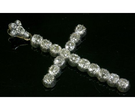 A Continental diamond set Latin cross, c.1870,possibly French.  A line of cushion cut diamonds all in silver cut down collets