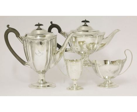 A silver matched four-piece tea and coffee set,by William Hutton & Sons Ltd, Sheffield 1912/1915,of panelled vase shape on pe