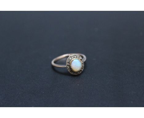 A VINTAGE OPAL AND DIAMOND RING, in a traditional setting, ring size M 1/2