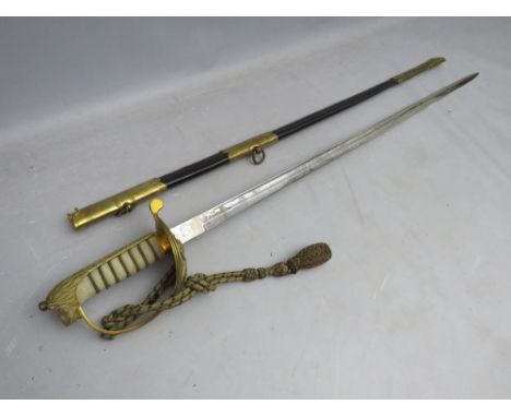 A 20TH CENTURY ELIZABETH II DECORATIVE NAVAL OFFICERS DRESS SWORD, with gold metal hand guard, in a gold metal and leather sc